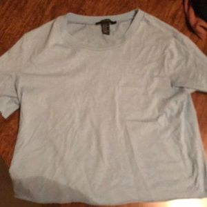 Light blue women’s crop top, short sleeve.